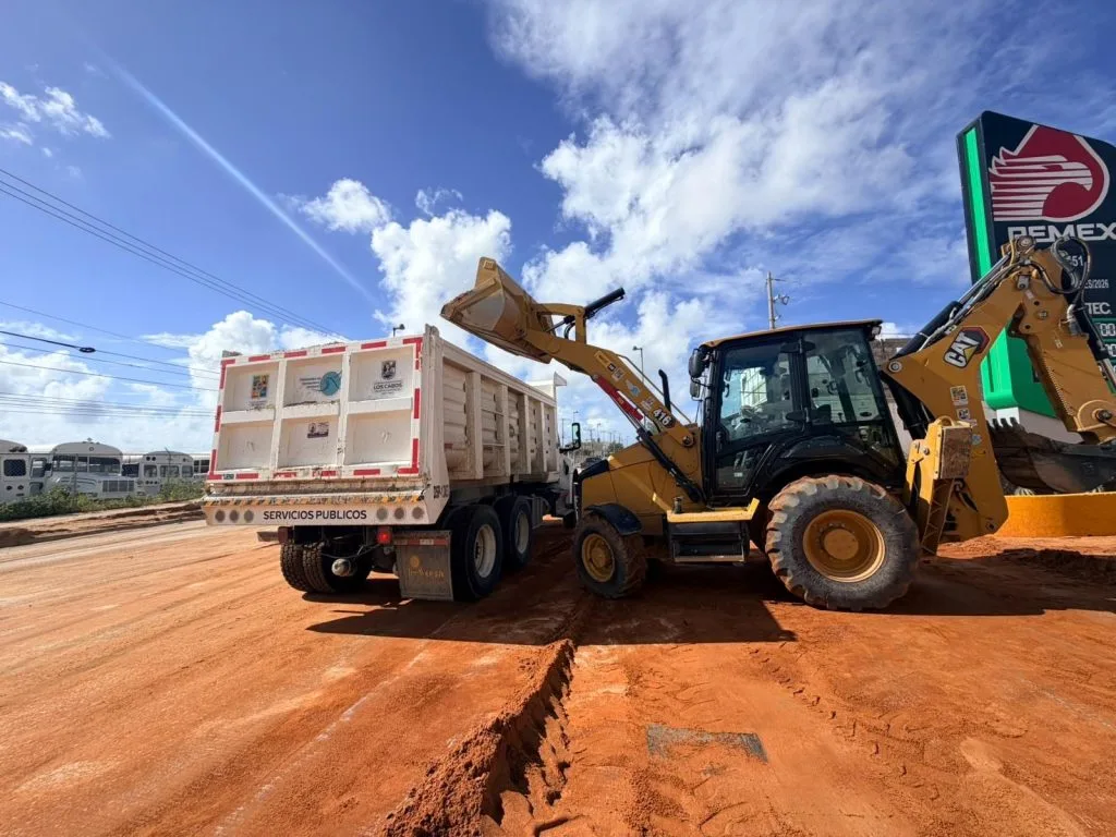 Motor grader clearing a street in Cabo San Lucas after the rain