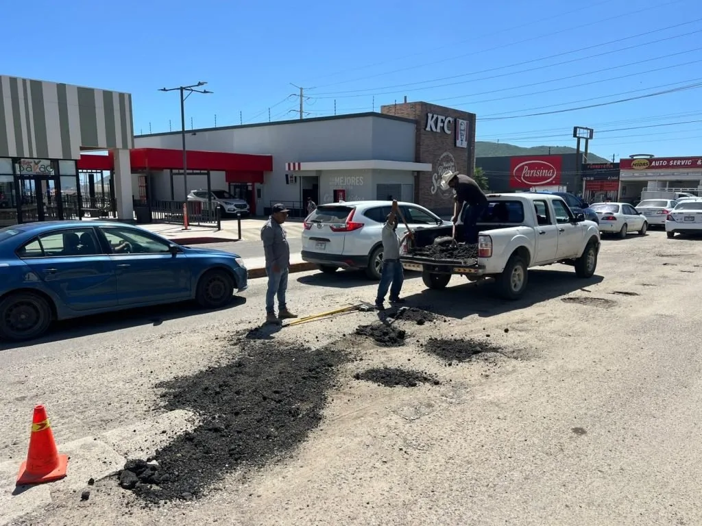 Public works crews patch potholes on Aguajitos street, Cabo San Lucas