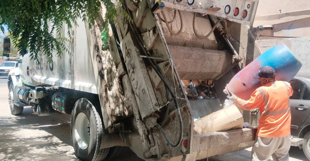 La Paz city garbage truck collecting waste in a neighborhood
